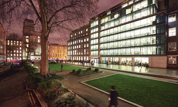 Light spills onto the square from Birkbeck’s Malet St building at
night