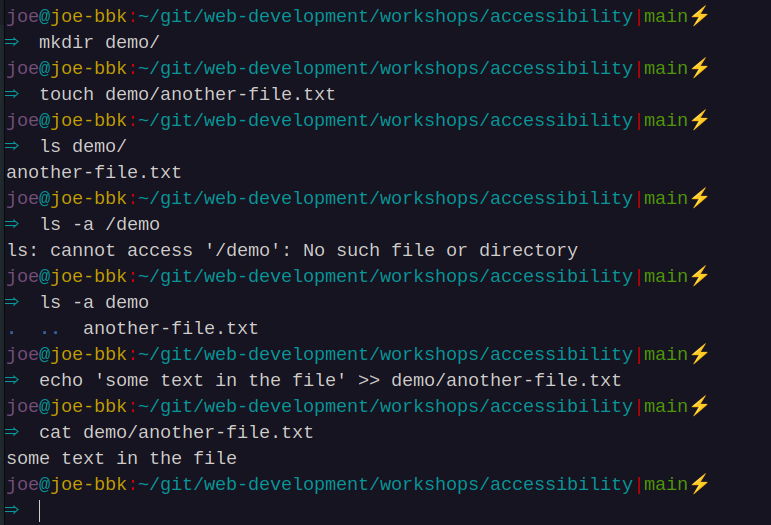 A command line interface showing commands like mkdir,
touch, ls, and cat